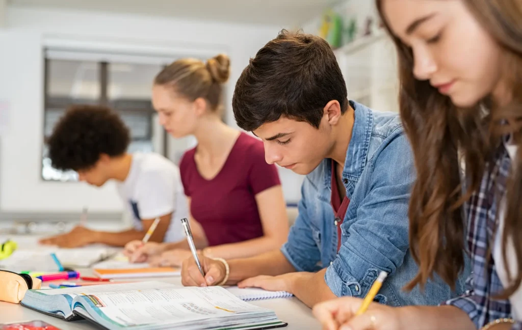 students in class, no phone in sight, just books