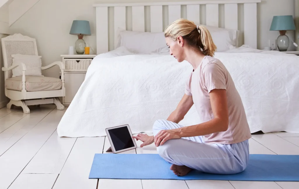 teacher at home meditating with app