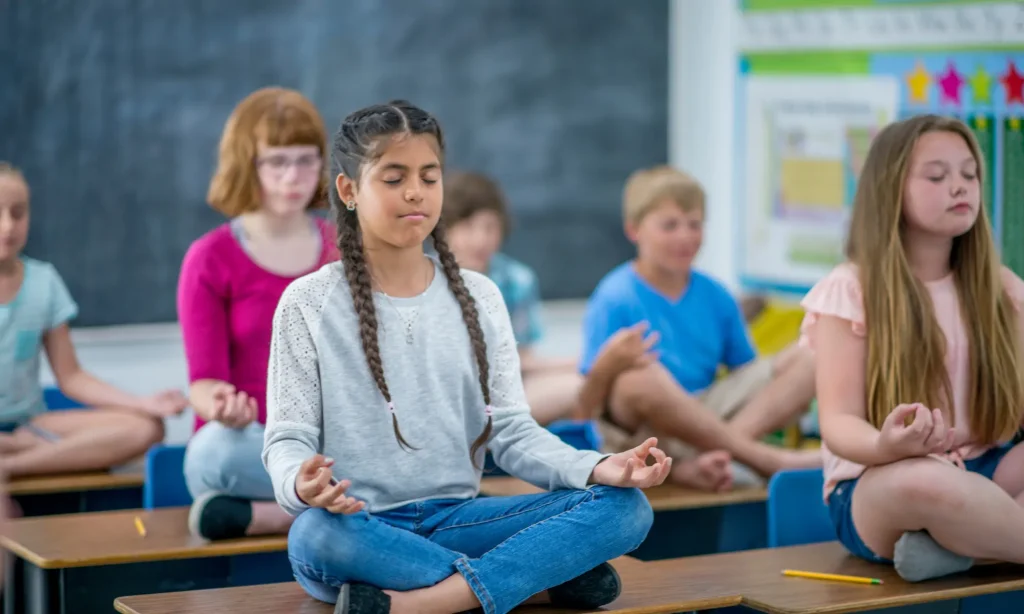 students practicing breathing in group