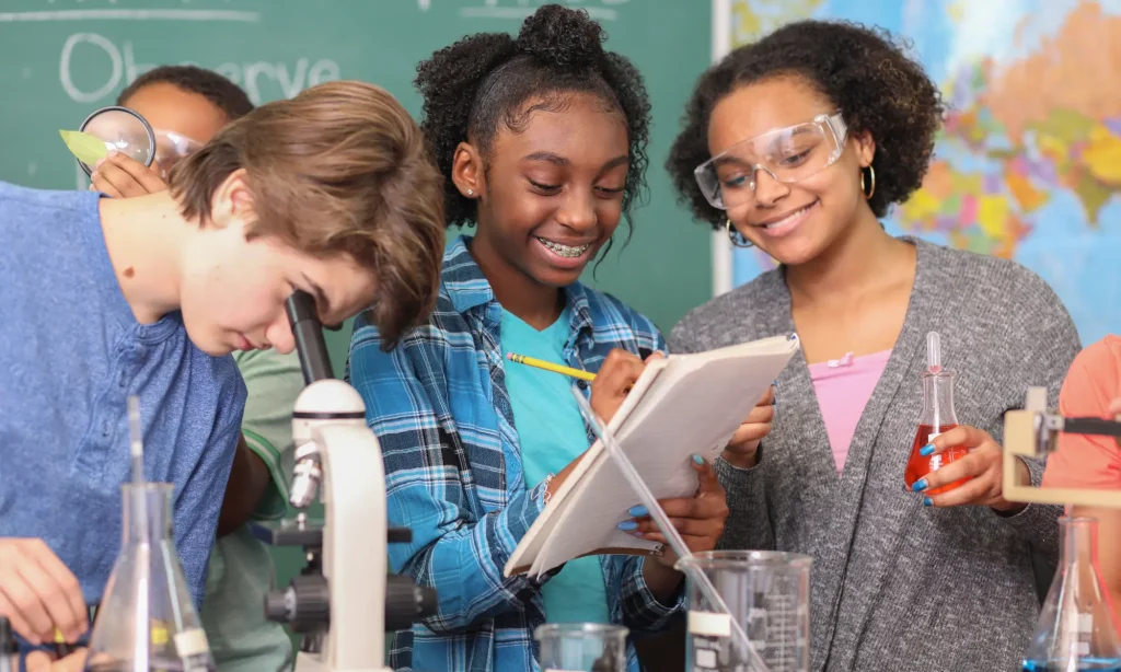 students learning about collaboration in science group project