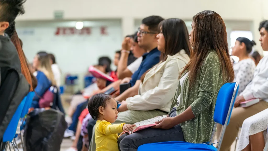 parents at school listening to training on teenager mental health and how to avoid stigma