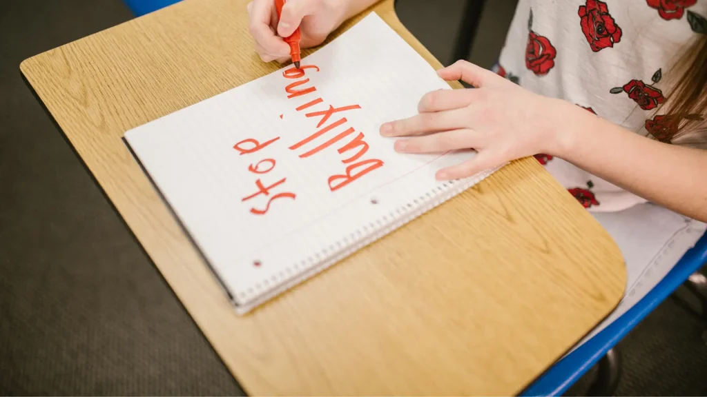 hand writing on notebook paper Stop Bullying