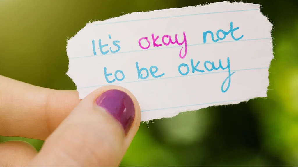 little note zoomed in that reads "it's okay not to be okay"